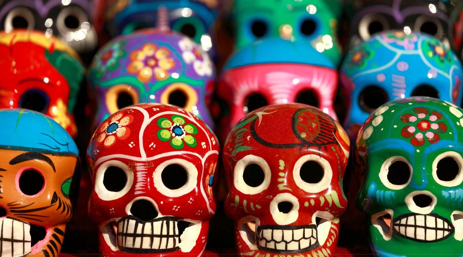 Ceramic sugar skulls from Mexico in different colors.