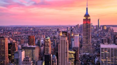 The New York City skyline at sunset.