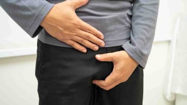 man suffering with hernia